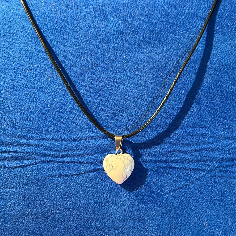 White with gray lines hart pendant necklace.